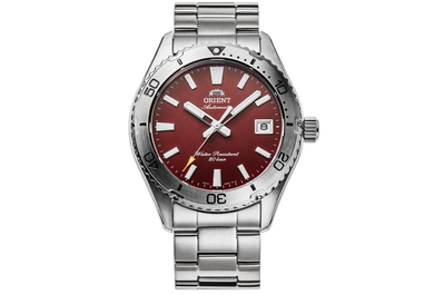 Silver wristwatch with a red face on a white background