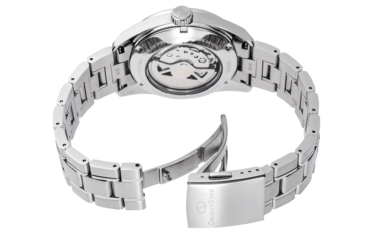 The back view of a stainless steel wristwatch with a multi-link bracelet and a visible automatic mechanical movement, featuring a polished clasp engraved with the Orient Star logo.

Orient Star RE-AU0108G